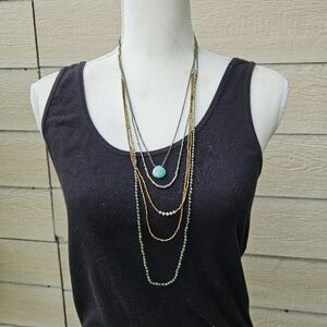 layered beaded necklace with banded blue-green stone pendant signed NAj 925